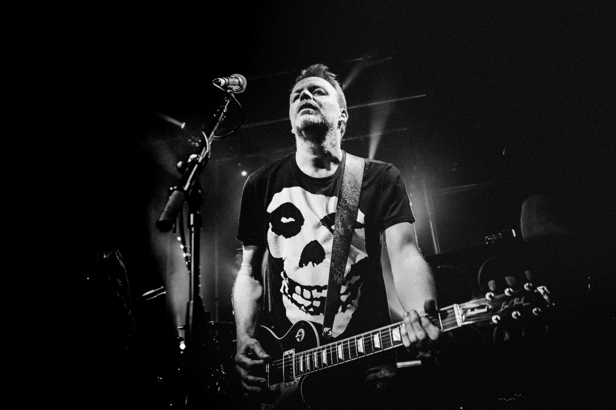 Concertfoto van gitarist